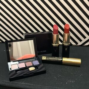 A brand new Estée Lauder make up set, 1 leopard pouch 1 eyeshadow, 2 lipsticks